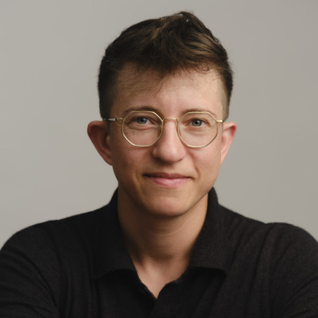 Person wearing glasses and looking at the camera